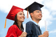 Couple of graduates outdoors