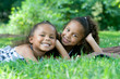Two beautiful mixed race sisters enjoying the park