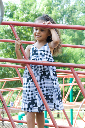 Photo: A beautiful mixed race child enjoying the playground A beautiful mixed race child enjoying the playground