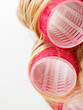 Red Curlers in Blond Hair