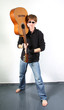 young red-haired guy with a guitar