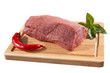 Raw beef on cutting board isolated on white background