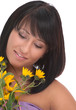 Portrait of a pretty young woman with yellow flowers