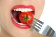 Eating a red tomato macro of woman mouth Eating a red tomato macro of woman mouth
