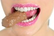 Chocolate sweet in beautiful woman mouth Chocolate sweet in beautiful woman mouth