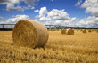 Straw bales with river and bridge in the Background