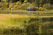Kids and Teachers at lake in Autumn.