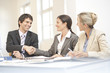 Foto: Three businesspeople in a meeting Three businesspeople in a meeting