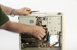 Photo: Person working on open computer chassis. Person working on open computer chassis.
