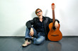 young red-haired guy with a guitar