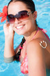 A smile made with suncream at the shoulder