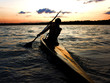 Photo: kayaker against sunset kayaker against sunset