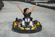happy brunette women wining the karting race