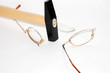 Glasses and hammer