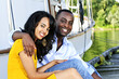 Happy couple in front of yacht