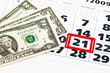 Dollar bills on calendar Dollar bills on calendar