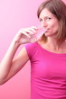 Pretty young woman drinking water