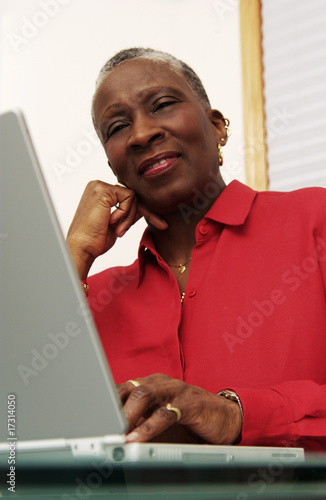 Photo: Older woman working on a laptop Older woman working on a laptop