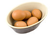 high view of eggs in dish isolated on white background