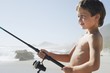 Boy Fishing on Beach