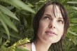 Woman Looking Out From Shrub