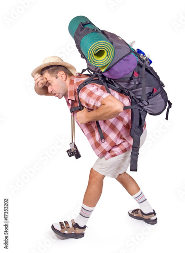 Photo: way-worn hiker with backpack way-worn hiker with backpack