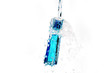 Perfume bottle on water splash