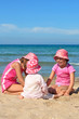 Three girls playing on the beach