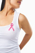 Photo: Woman using pink ribbon on her chest to support breast cancer ca Woman using pink ribbon on her chest to support breast cancer ca