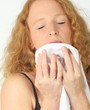 smelling clean laundry - housework - housewife