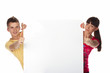 young couple presenting a blank board over white background young couple presenting a blank board over white background