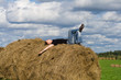 young man on a stackhay