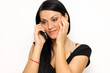 Closeup portrait of a funny woman with a phone standing indoors
