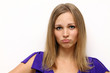 Closeup portrait of a funny woman standing indoors
