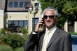 Mature businessman with mobile phone