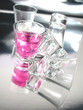 Cherry cocktail shot on silver floor Cherry cocktail shot on silver floor