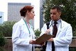 Doctors downtown outside discuss lab results