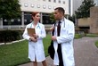 City doctors outside walking and talking