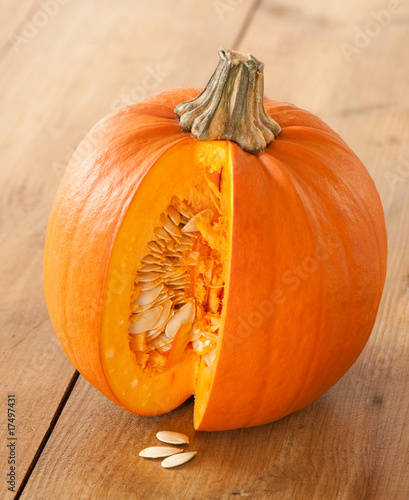 Photo: Cut Pumpkin Exposing Seeds Cut Pumpkin Exposing Seeds