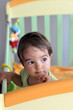 Baby standing in bed