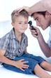 Doctor examining a patient' s ears with a otoscope Doctor examining a patient' s ears with a otoscope