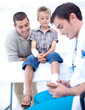 Doctor bandaging a child's foot