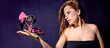 Young pretty woman hold sandal  at palm