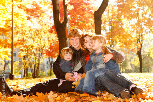 Photo: Family on autumn leaves Family on autumn leaves