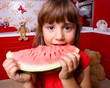 The girl winh a watermelon