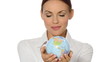 Beautiful young businesswoman is holding a globe