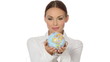 Beautiful young businesswoman is holding a globe