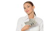 Beautiful young businesswoman is holding bunch of money