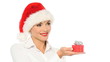 Sexy girl in santa claus hat showing a gift in box