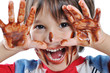 Little cute kid with chocolate on face and hands Little cute kid with chocolate on face and hands